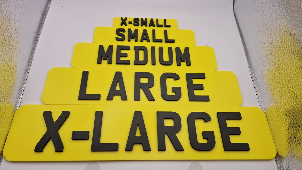 5 different sizes of registration plate available positioned next to each other, in yellow with black 3d writing